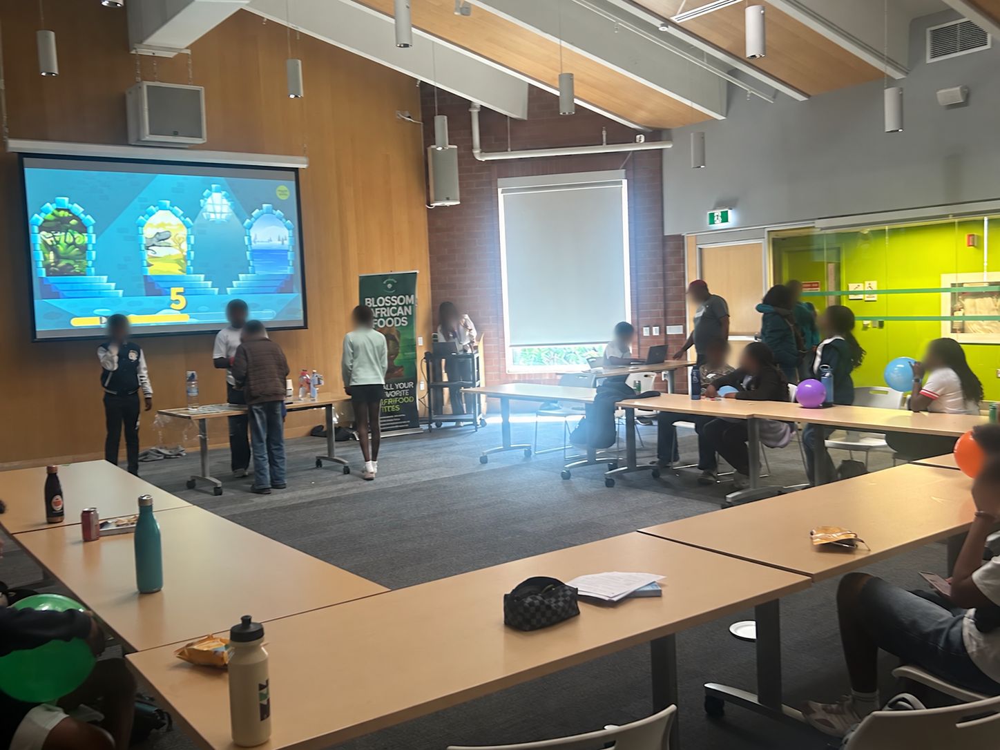 Younger learners take part in a group STEM activity.